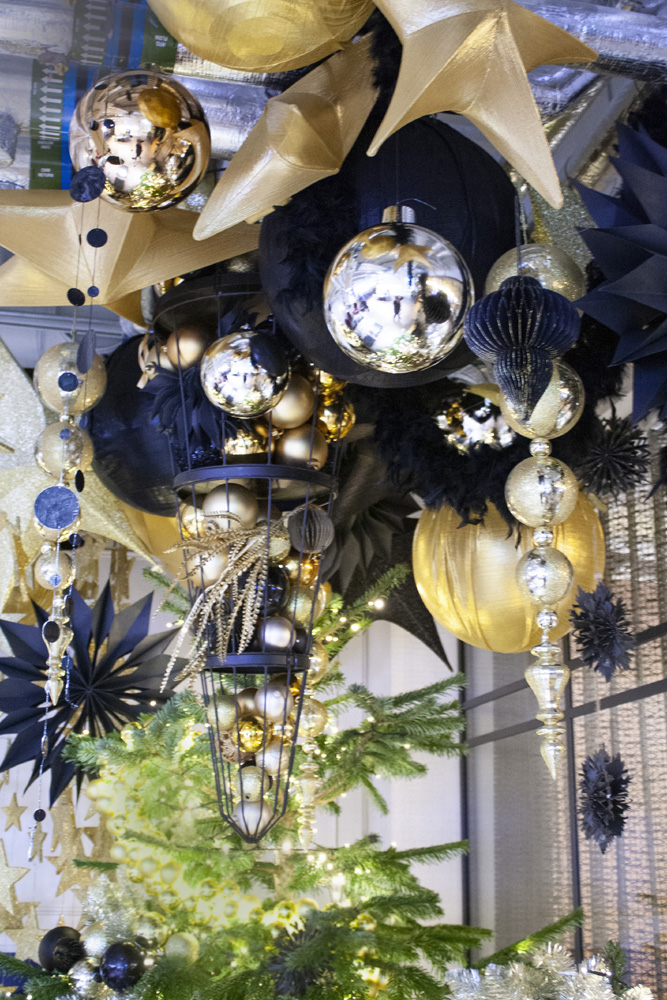 9. McCann 2022 Xmas decor from ceiling with upside down cage lr