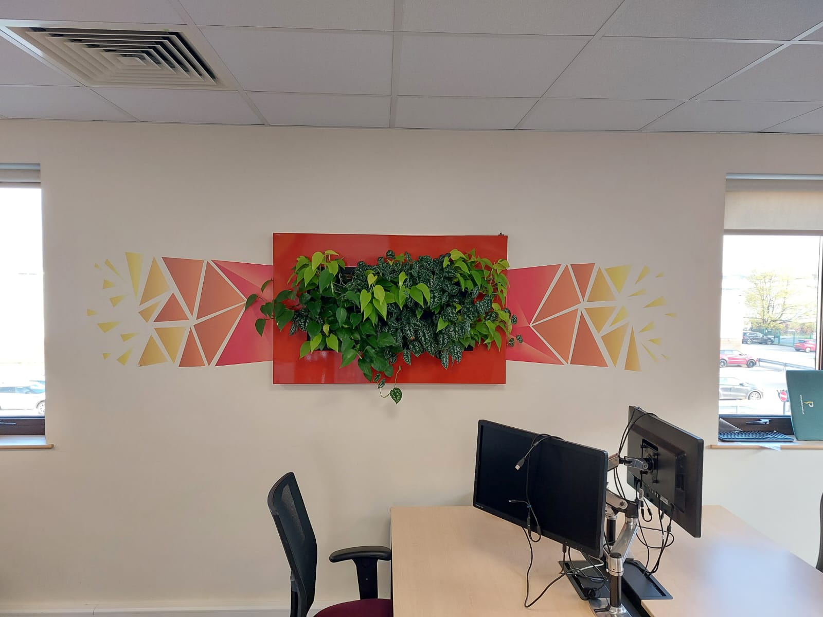 A contrast of greens and patterns to compliment the wall mural